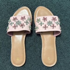 Sandals pink with jewels on top.